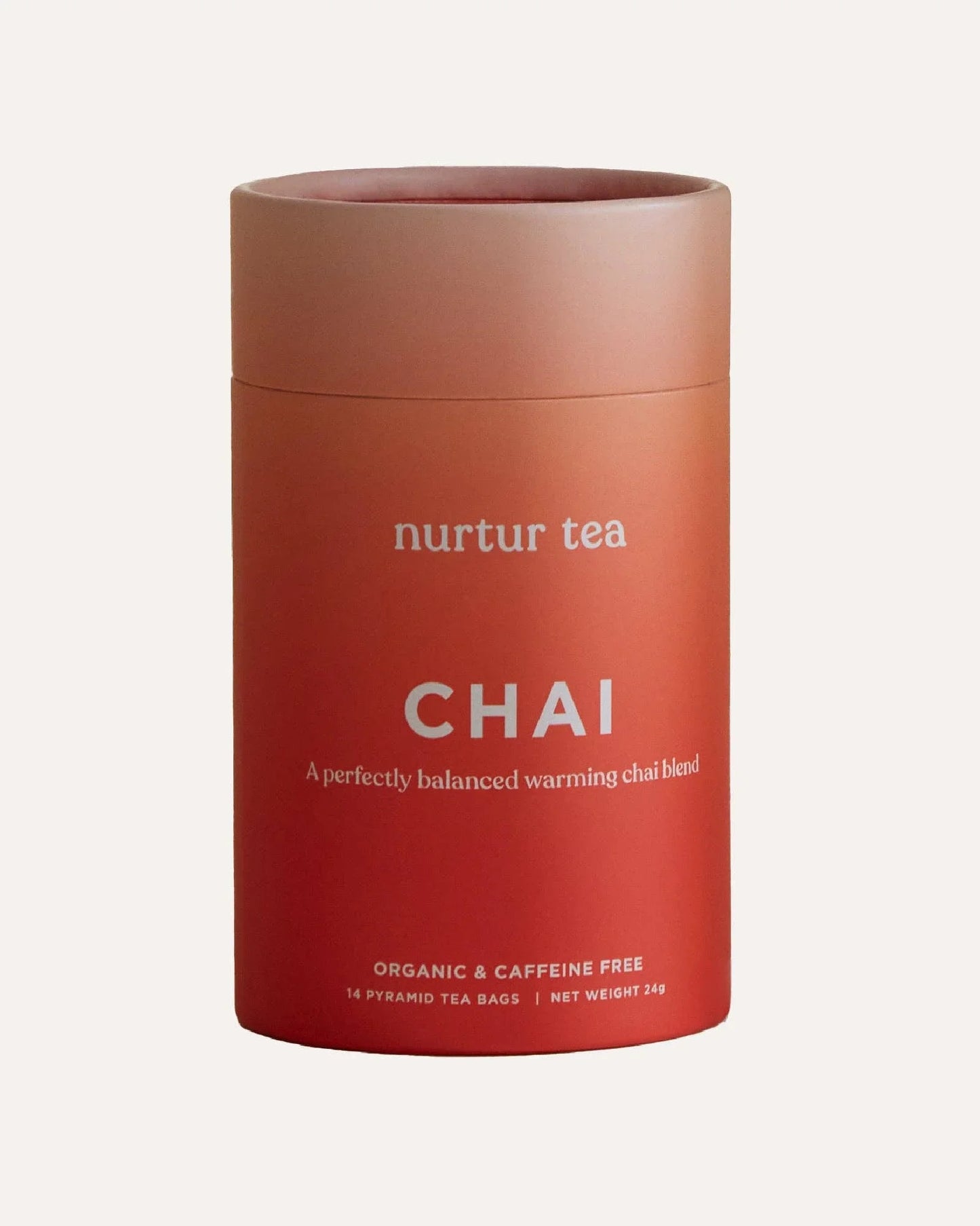 Organic caffeine-free chai tea in orange-red cylindrical packaging by Nurtur Tea. Come see us at Awaken, Franklin, Tennessee