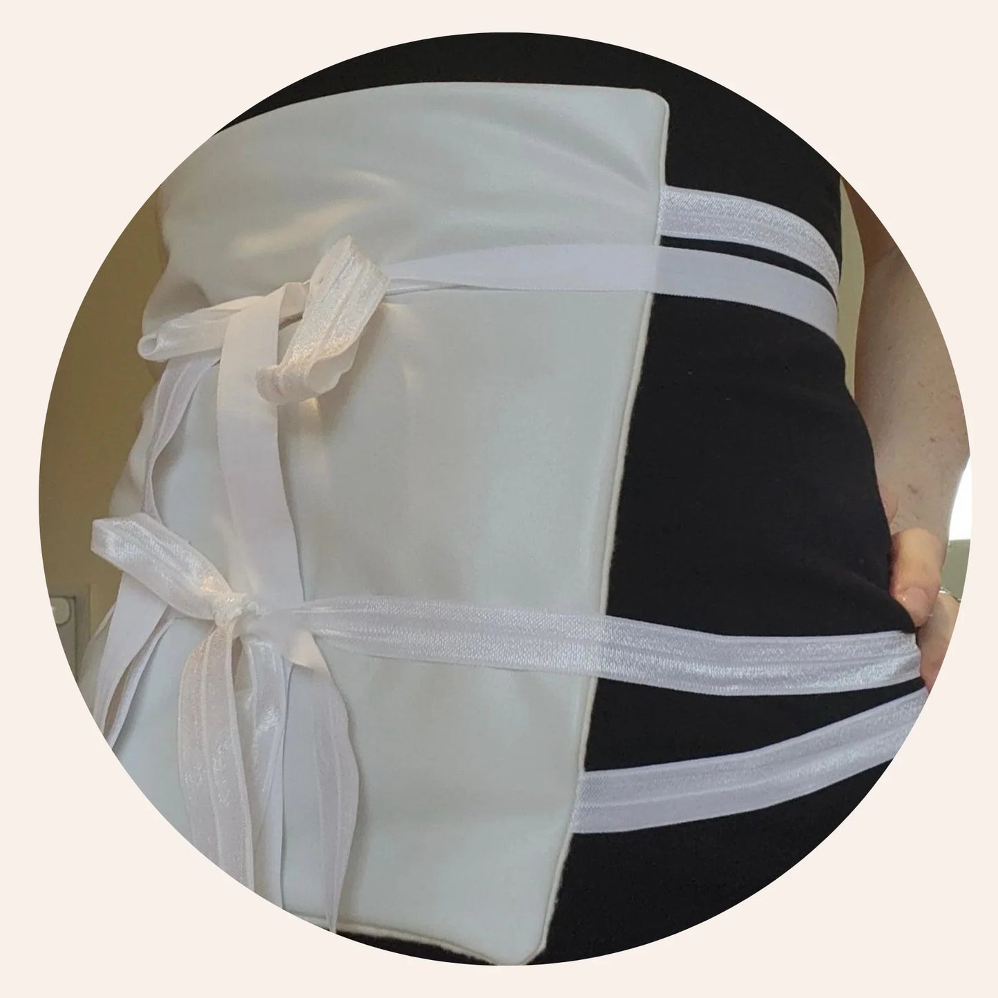 Black and white handmade abdominal binder with white ribbon ties on person, soft fabric, Come see us at Awaken, Franklin, Tennessee