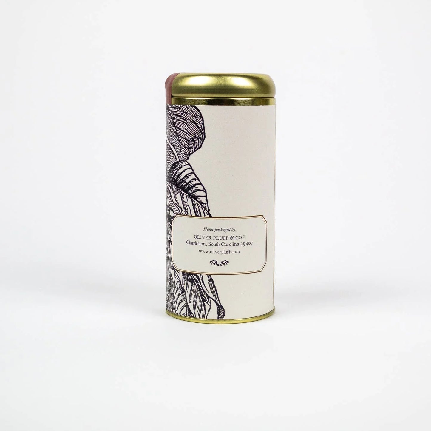 Oliver Pluff & Co. cylindrical tin with gold lid and leaf design on white, Come see us at Awaken, Franklin, Tennessee