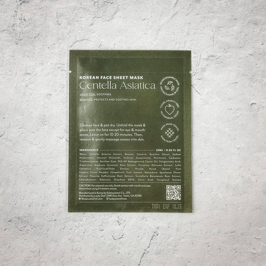 Centella Asiatica Korean face sheet mask for soothing skin on gray textured background. Come see us at Awaken, Franklin, Tennessee