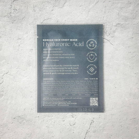 Korean Hyaluronic Acid face sheet mask package with skincare benefits and usage directions, on light textured surface. Come see us at Awaken, Franklin, Tennessee