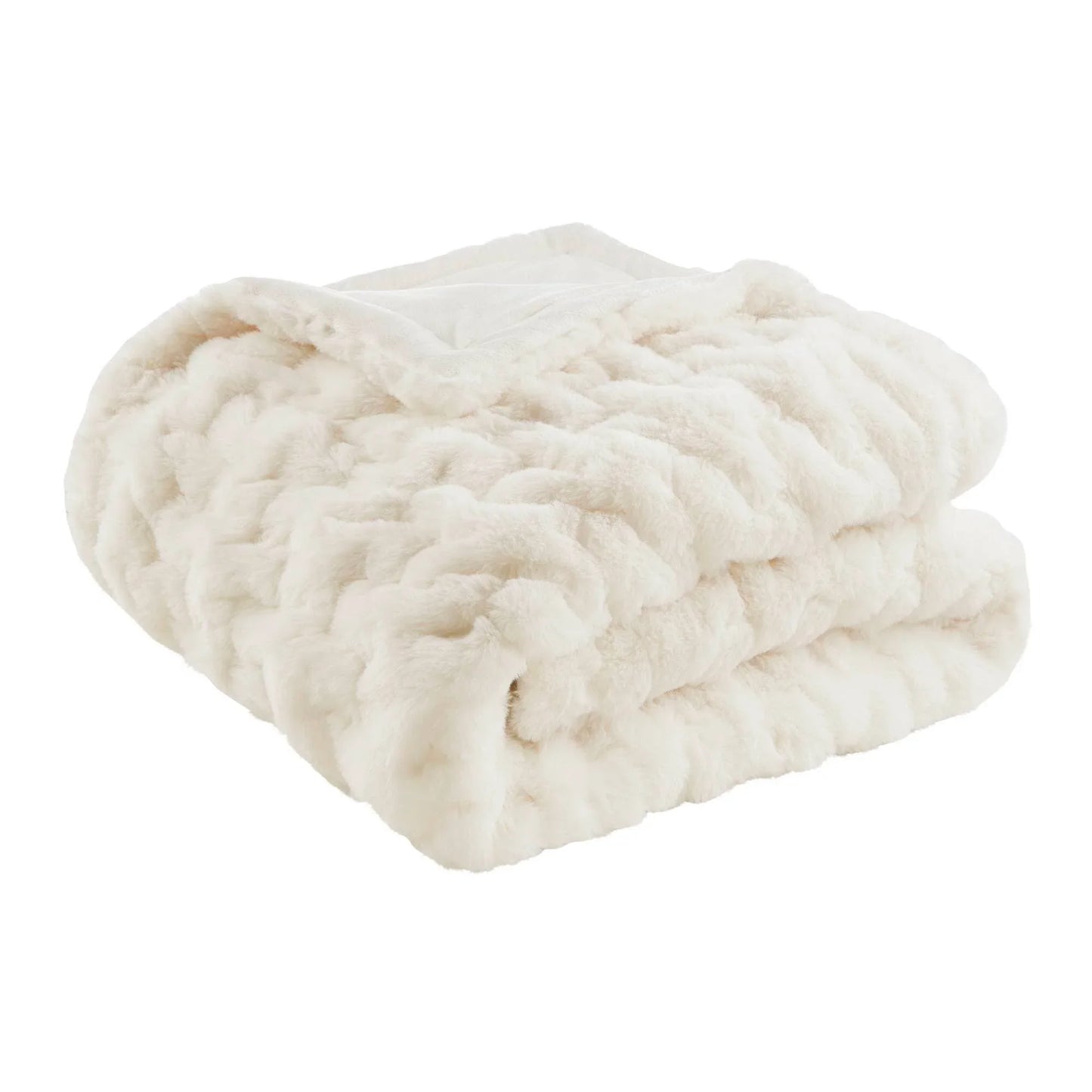 Folded plush cream-colored faux fur blanket with a soft texture. Come see us at Awaken, Franklin, Tennessee