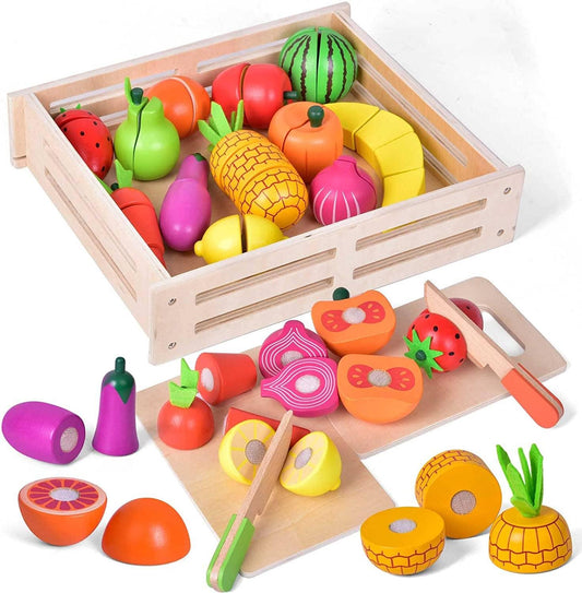 Colorful wooden toy fruits and vegetables with cutting boards and knives in a wooden crate, come see us at Awaken, Franklin, Tennessee