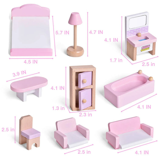 Pink and white wooden dollhouse furniture set with bed, lamp, sink, table, cabinet, bathtub, chair, armchair, and sofa. Come see us at Awaken, Franklin, Tennessee