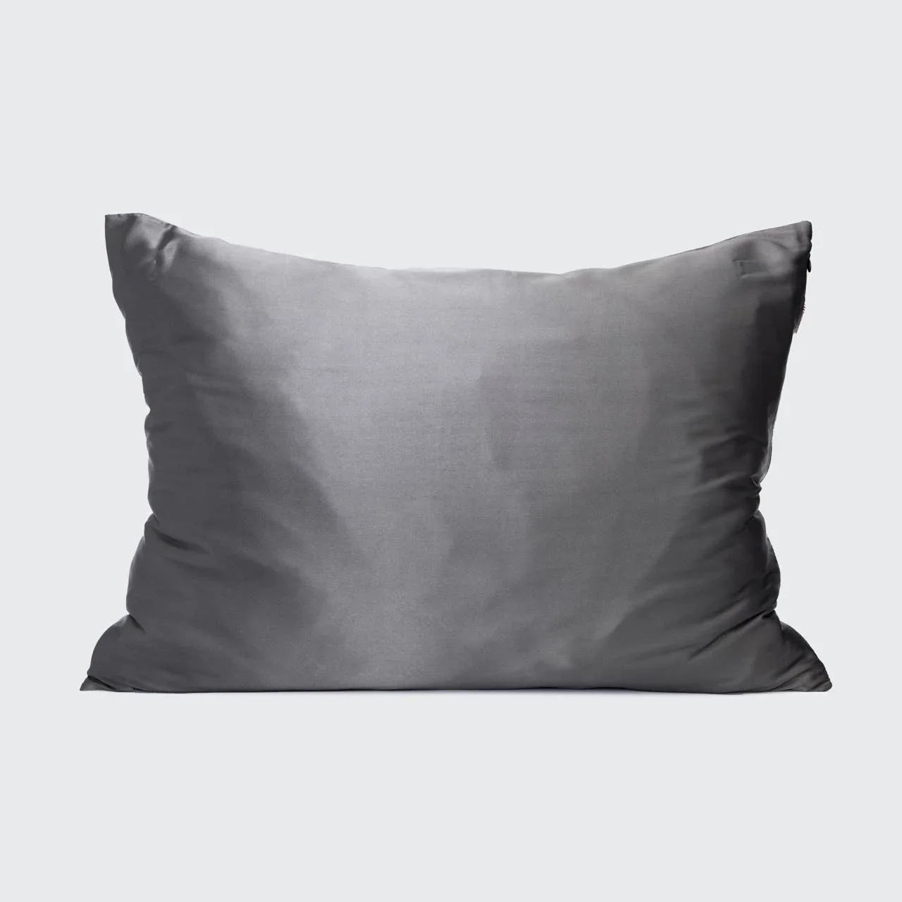 Gray rectangular pillow with smooth texture on white background. Come see us at Awaken, Franklin, Tennessee