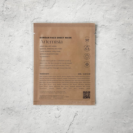 Korean Artemisia face sheet mask package on textured white surface, anti-aging skincare. Come see us at Awaken, Franklin, Tennessee