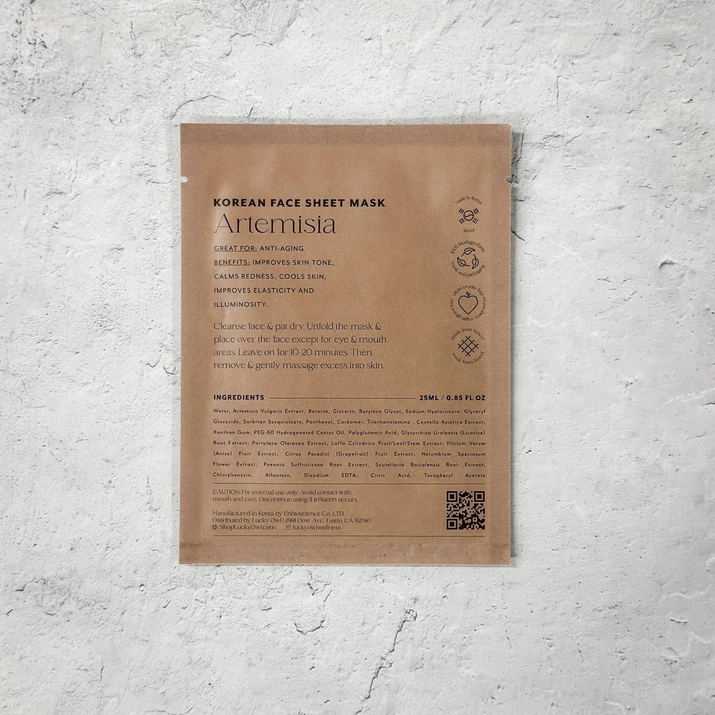 Korean Artemisia face sheet mask package on textured white surface, anti-aging skincare. Come see us at Awaken, Franklin, Tennessee