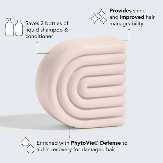 Light pink solid shampoo bar highlighting hair benefits like saving 2 bottles, shine, and PhytoVie Defense. Come see us at Awaken, Franklin, Tennessee