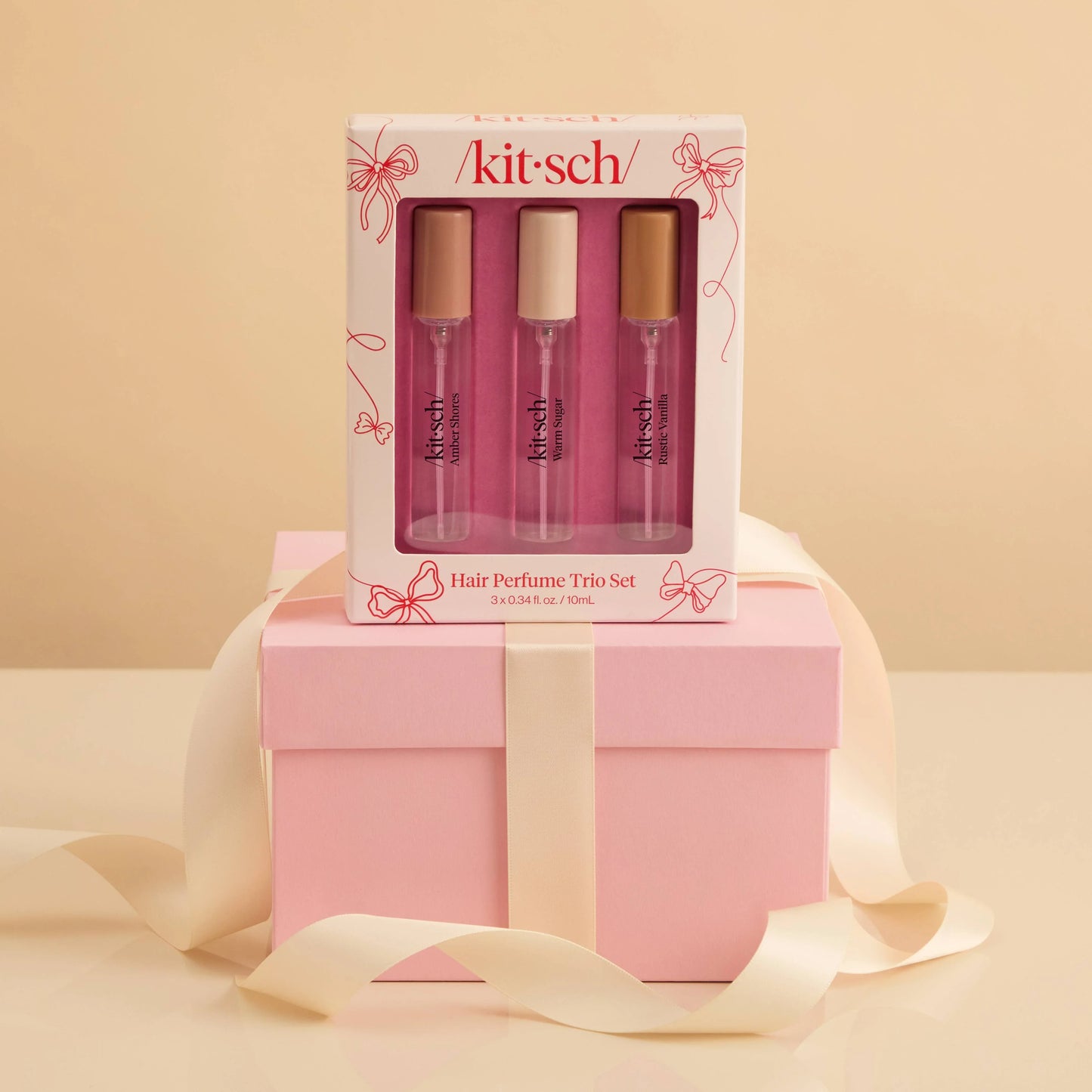 Kitsch Hair Perfume Trio Set with Amber Shores, Warm Sugar, Rustic Vanilla on pink gift box. Come see us at Awaken, Franklin, Tennessee