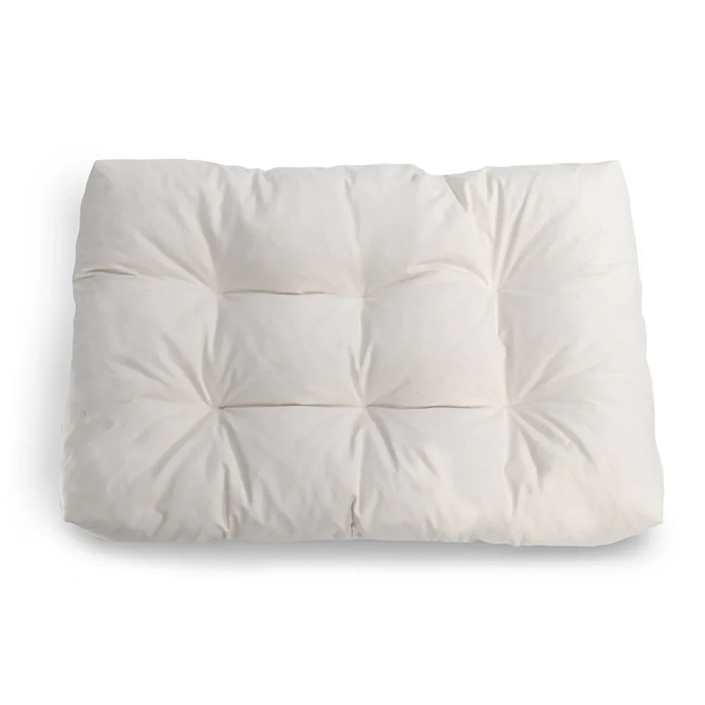 Soft white cotton futon mattress with tufted design isolated on white background. Come see us at Awaken, Franklin, Tennessee