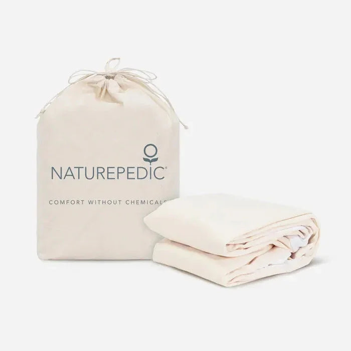 Naturepedic organic bedding with cream fabric storage bag, comfort without chemicals. Come see us at Awaken, Franklin, Tennessee