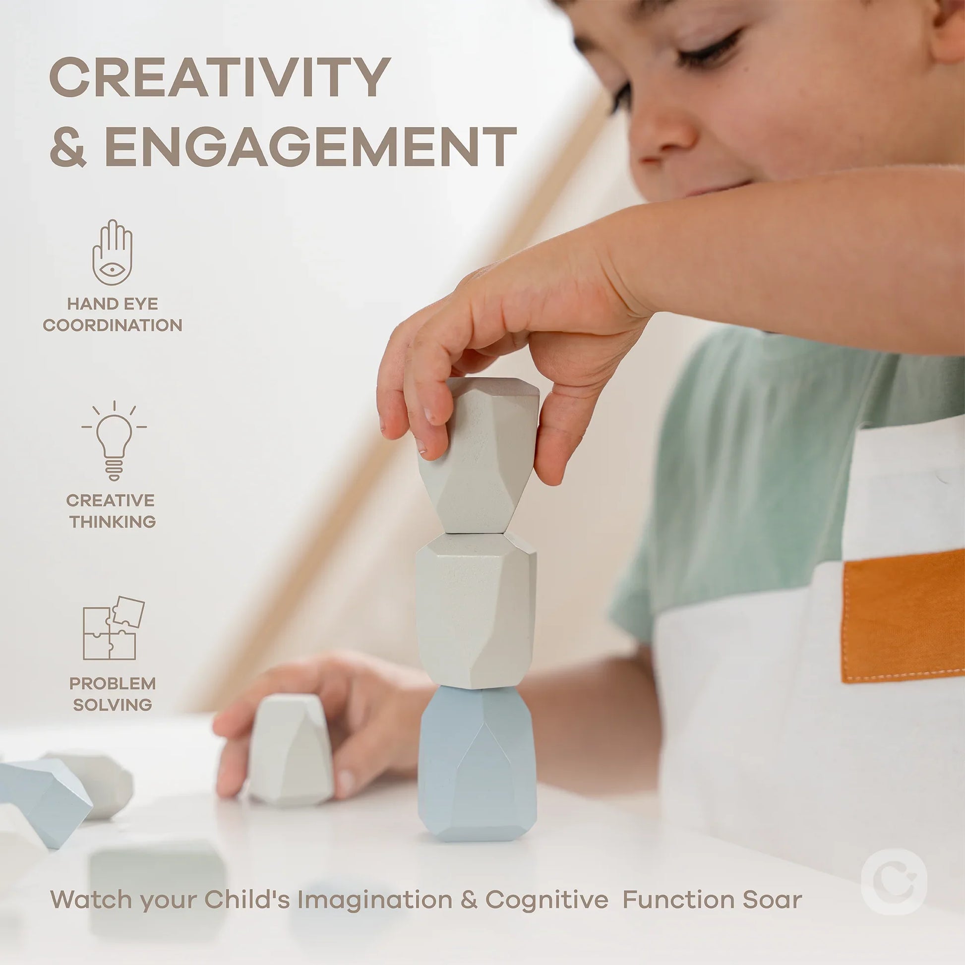 Child playing with wooden blocks enhancing creativity and engagement. Come see us at Awaken, Franklin, Tennessee