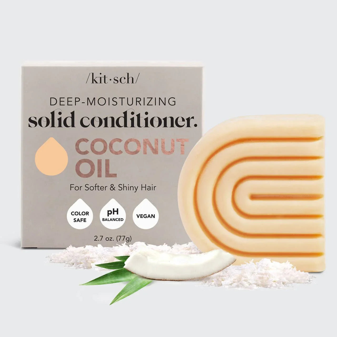 Kitsch deep-moisturizing solid coconut oil conditioner bar with packaging and coconut pieces. Come see us at Awaken, Franklin, Tennessee.