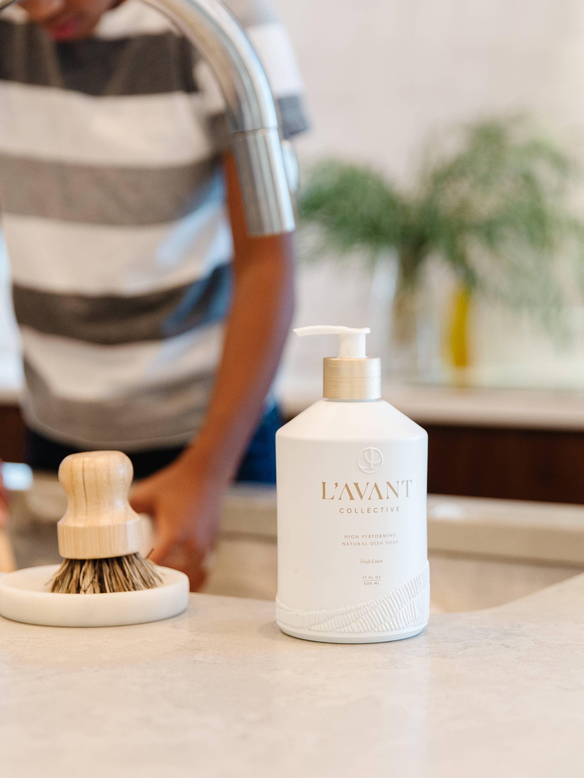 L'AVANT Collective dish soap and scrub brush by kitchen sink, Come see us at Awaken, Franklin, Tennessee