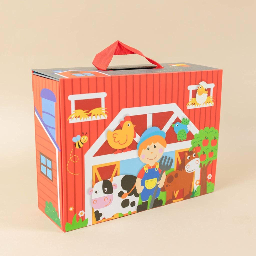 Colorful farm-themed kids playset box with farmer, animals, and barn design. Come see us at Awaken, Franklin, Tennessee