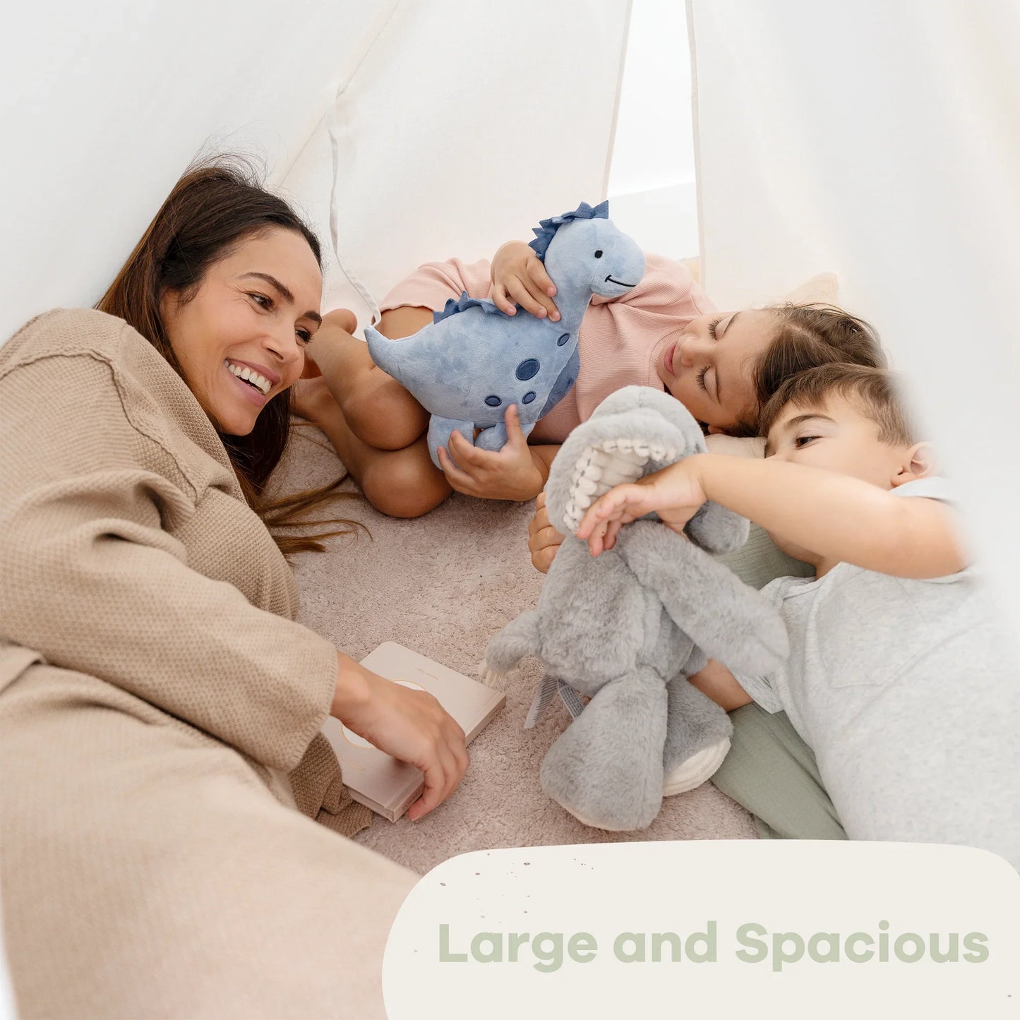 Mother and children playing with plush toys in cozy tent, Large and Spacious. Come see us at Awaken, Franklin, Tennessee.