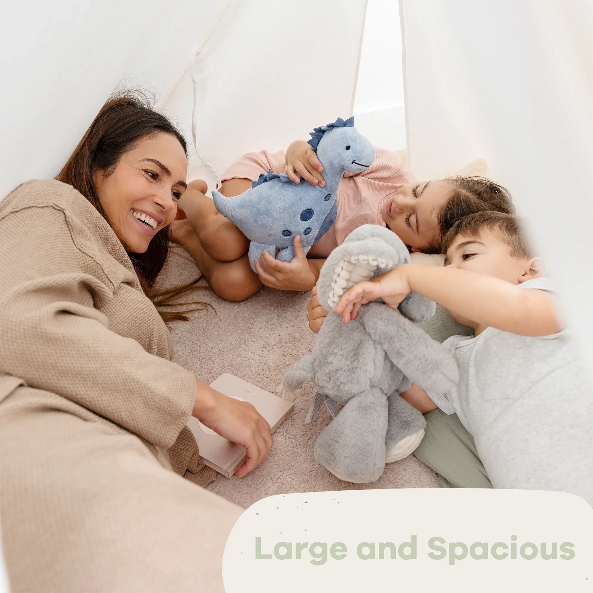 Mother and children playing with plush toys in cozy tent, Large and Spacious. Come see us at Awaken, Franklin, Tennessee.