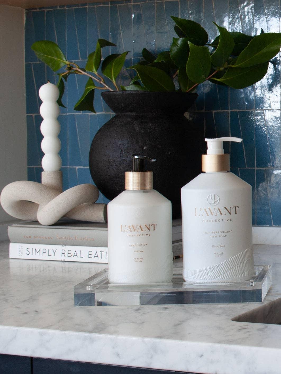 L'AVANT Collective lotion and dish soap on marble counter with decor, Come see us at Awaken, Franklin, Tennessee