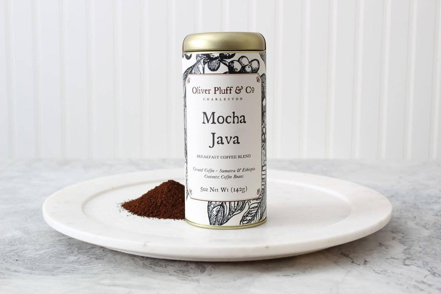 Oliver Pluff & Co Mocha Java ground coffee tin with coffee grounds on white plate, Come see us at Awaken, Franklin, Tennessee