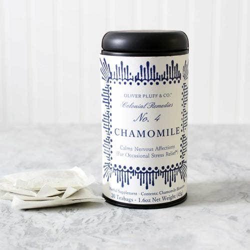 Oliver Pluff & Co Chamomile tea canister with teabags on marble surface, calming herbal supplement. Come see us at Awaken, Franklin, Tennessee