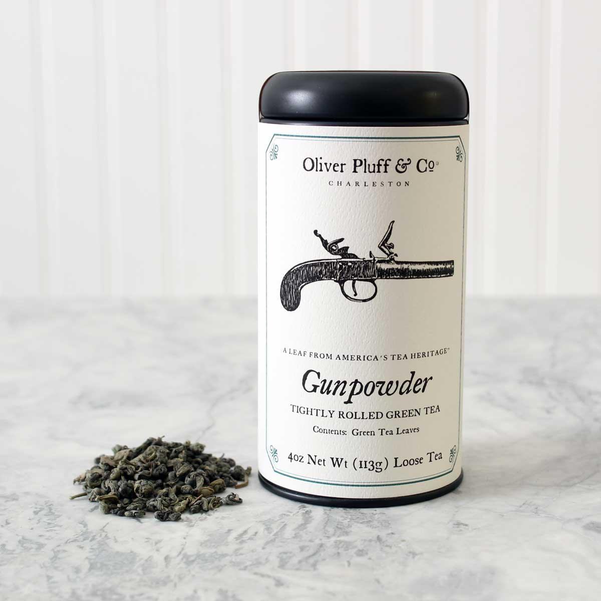 Oliver Pluff & Co. Gunpowder green tea canister with loose tea leaves on marble surface, Come see us at Awaken, Franklin, Tennessee
