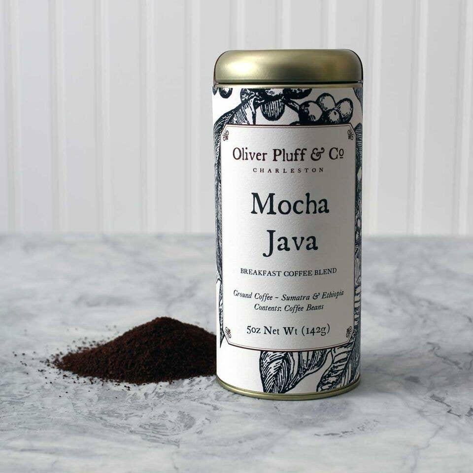Oliver Pluff & Co Mocha Java ground coffee tin beside coffee grounds on marble surface, Come see us at Awaken, Franklin, Tennessee