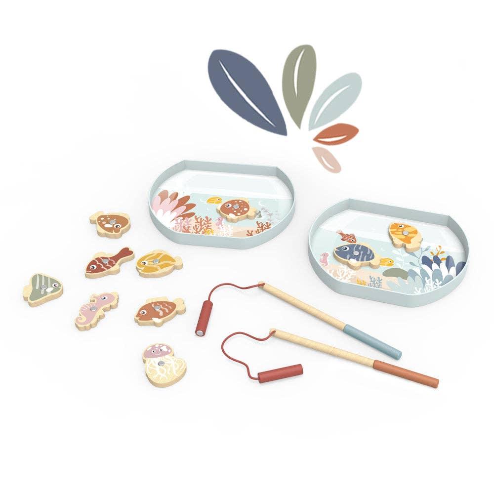 Wooden magnetic fishing game with colorful fish, two fishing rods, and decorative ocean trays. Come see us at Awaken, Franklin, Tennessee