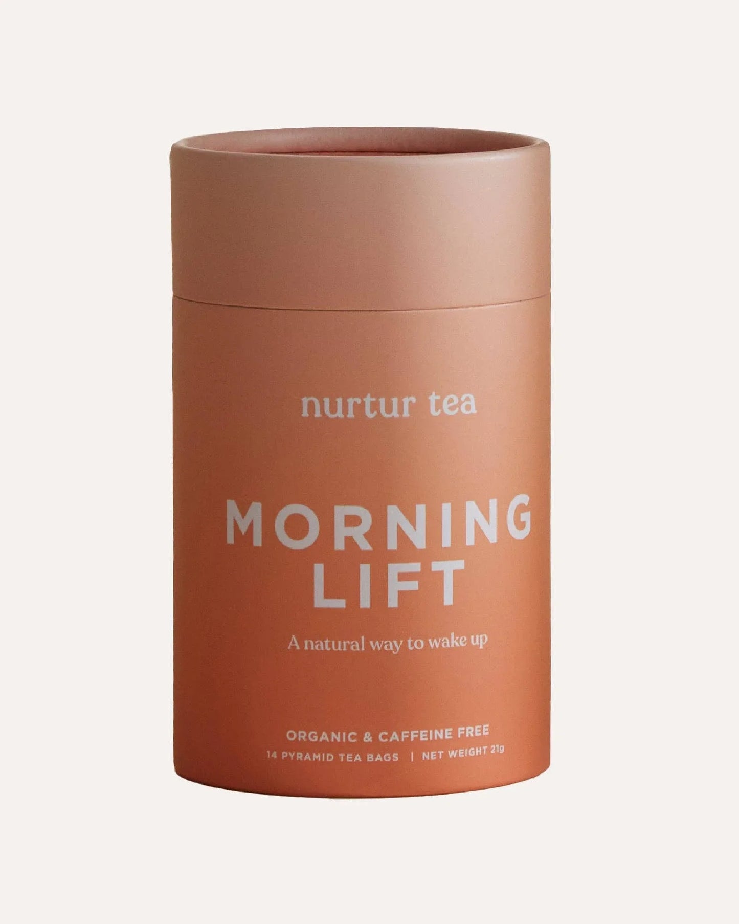 Organic caffeine-free Morning Lift nurtur tea in peach container with 14 pyramid tea bags. Come see us at Awaken, Franklin, Tennessee.