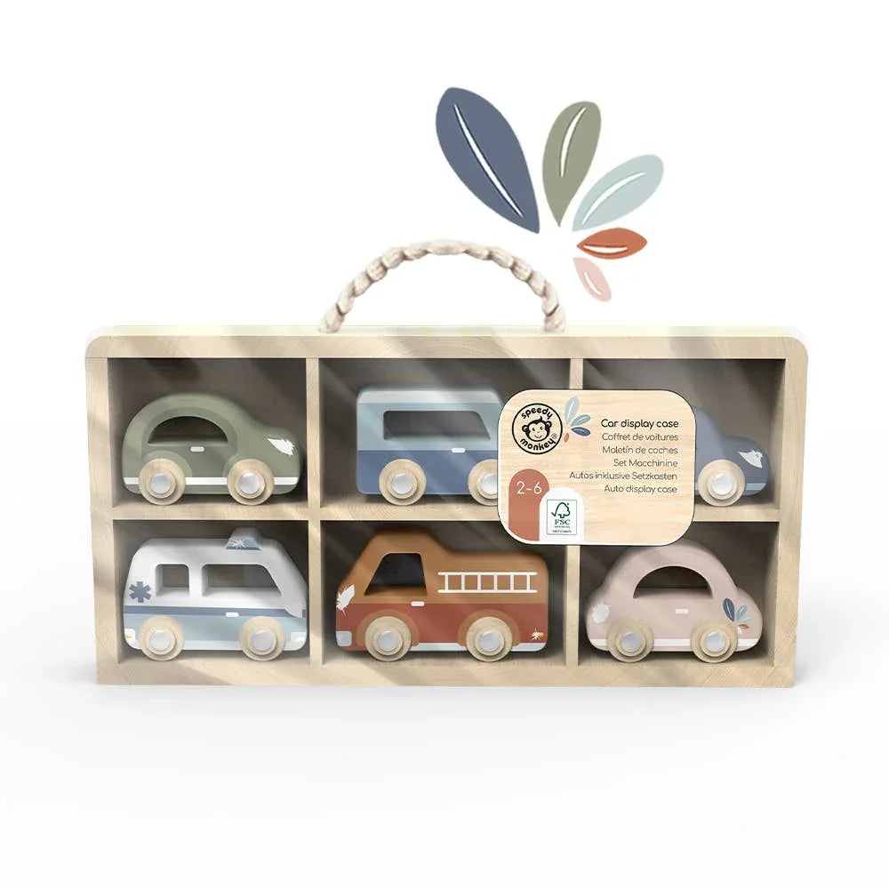 Wooden toy car display case with six pastel-colored vehicles in natural wood box. Come see us at Awaken, Franklin, Tennessee