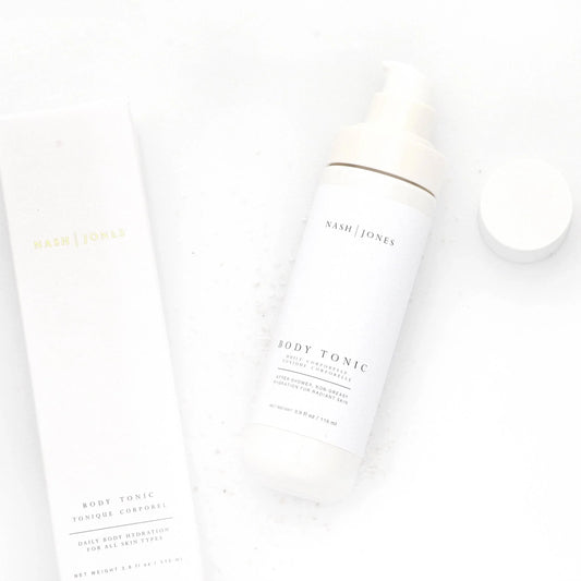 Nash | Jones Body Tonic skincare bottle and box on white background. Come see us at Awaken, Franklin, Tennessee