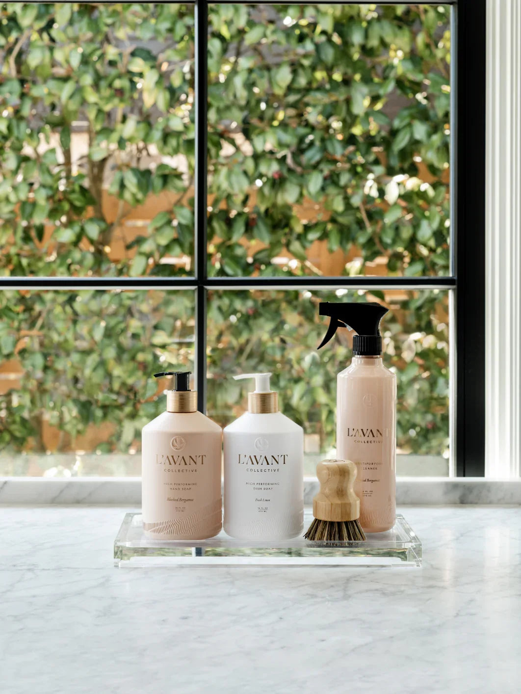 L'AVANT cleaning products set on marble counter by window, Come see us at Awaken, Franklin, Tennessee