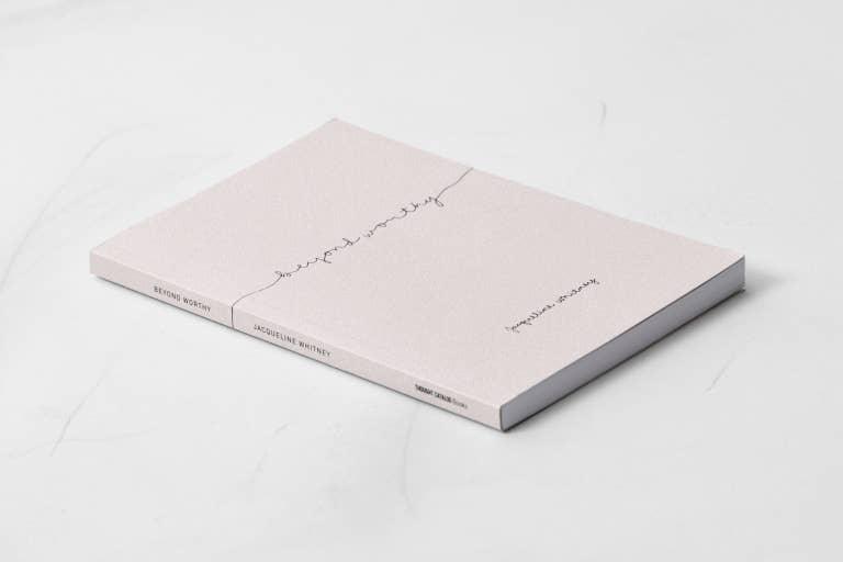 Soft pink book titled 'Beyond Worthy' by Jacqueline Whitney on white surface. Come see us at Awaken, Franklin, Tennessee