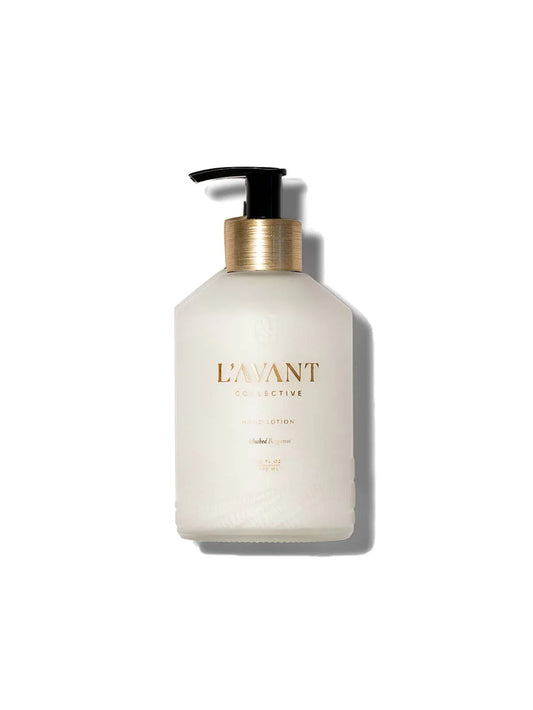 L'AVANT Collective hand lotion bottle with gold accents on white background, Come see us at Awaken, Franklin, Tennessee