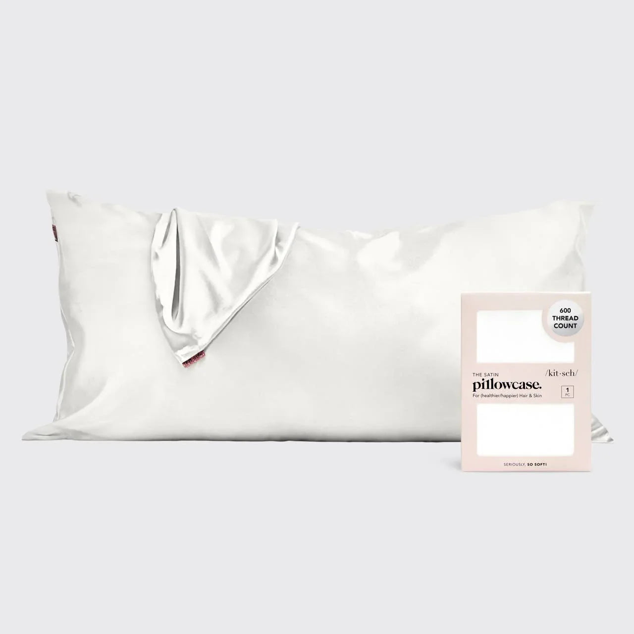 White satin pillowcase with 600 thread count displayed with packaging on light gray background, Come see us at Awaken, Franklin, Tennessee