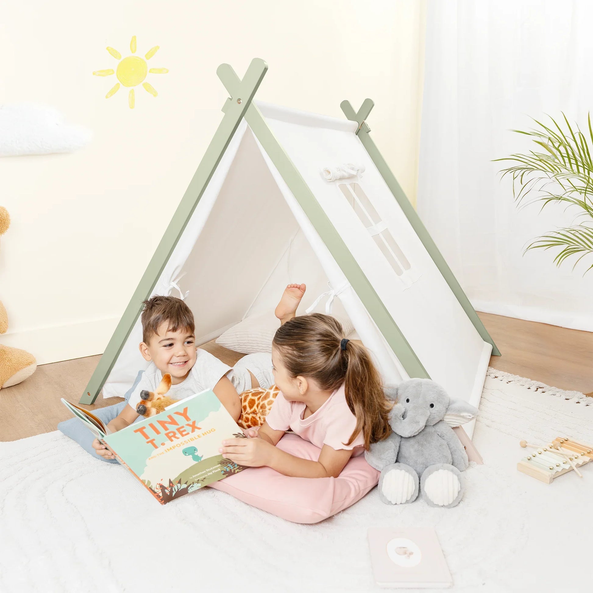 Kids reading in play tent with plush toys, bright nursery, Come see us at Awaken, Franklin, Tennessee