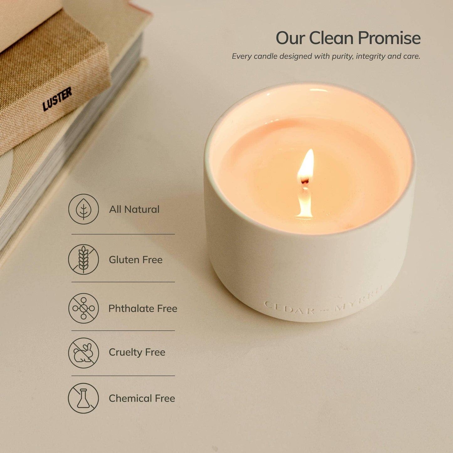 Natural soy candle in white jar with clean promise icons, books near, Come see us at Awaken, Franklin, Tennessee