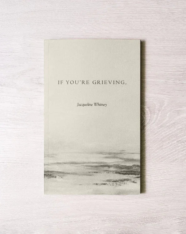 Book titled 'If You're Grieving' by Jacqueline Whitney on a light wooden surface, Come see us at Awaken, Franklin, Tennessee