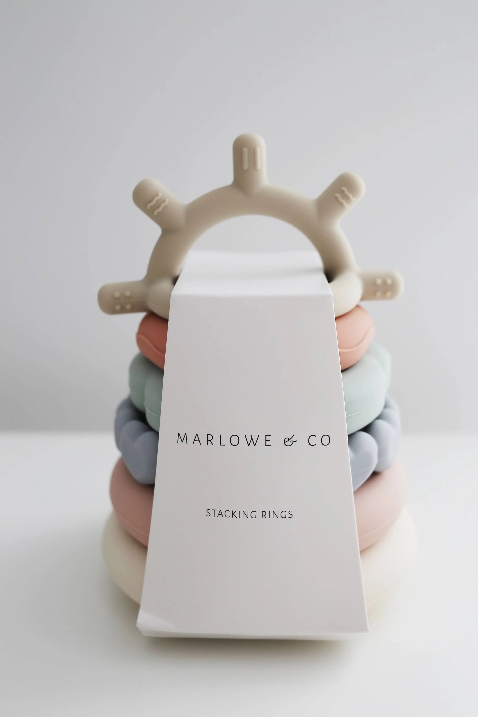 Marlowe & Co pastel silicone stacking rings toy on white background, Come see us at Awaken, Franklin, Tennessee