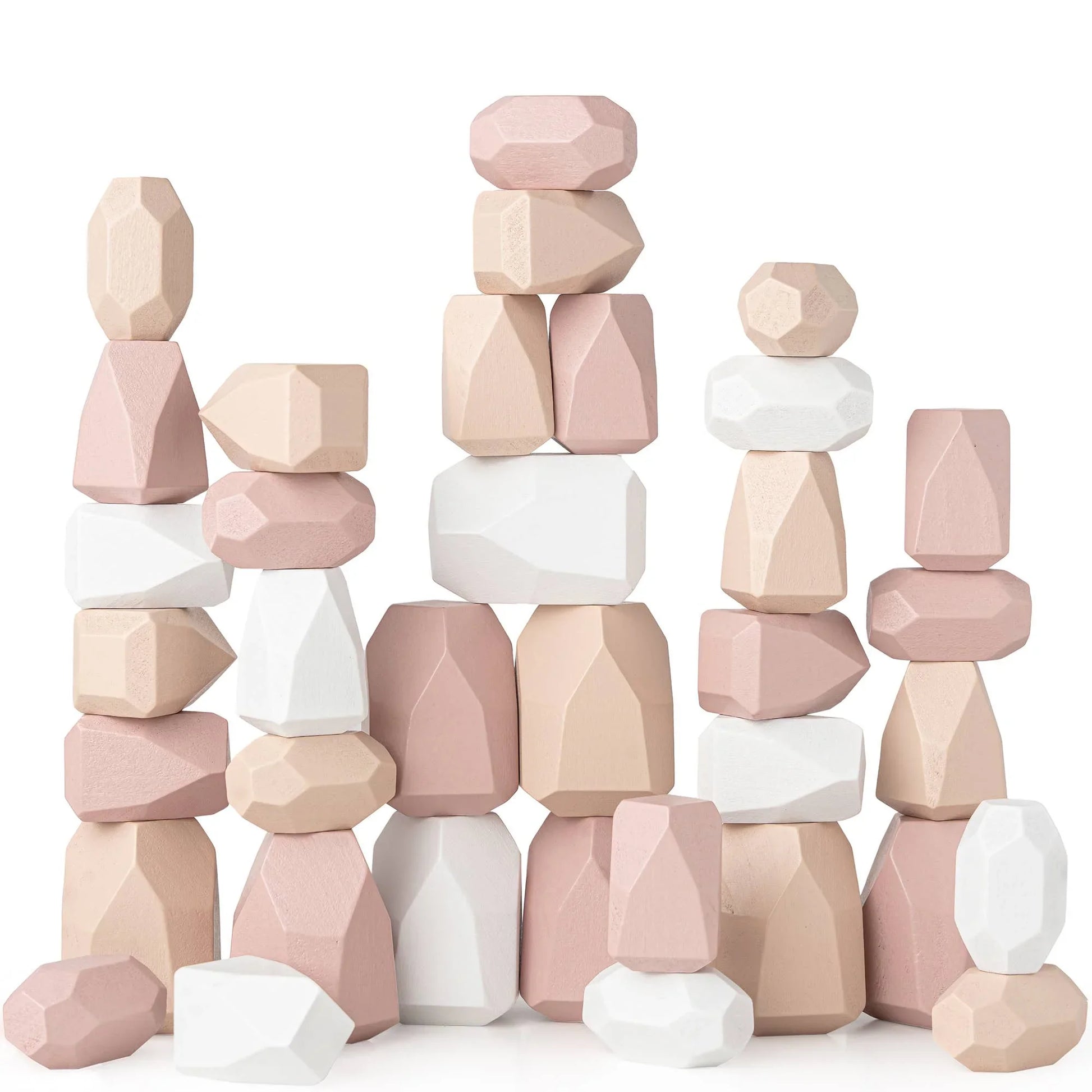 Stacked pastel pink, beige, and white wooden geometric blocks on white background. Come see us at Awaken, Franklin, Tennessee