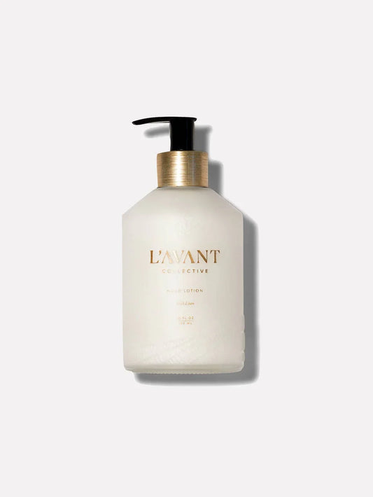 L'AVANT Collective hand lotion bottle with gold label, pump top. Come see us at Awaken, Franklin, Tennessee.