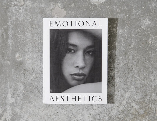 Emotional Aesthetics book with black and white portrait on textured concrete background. Come see us at Awaken, Franklin, Tennessee