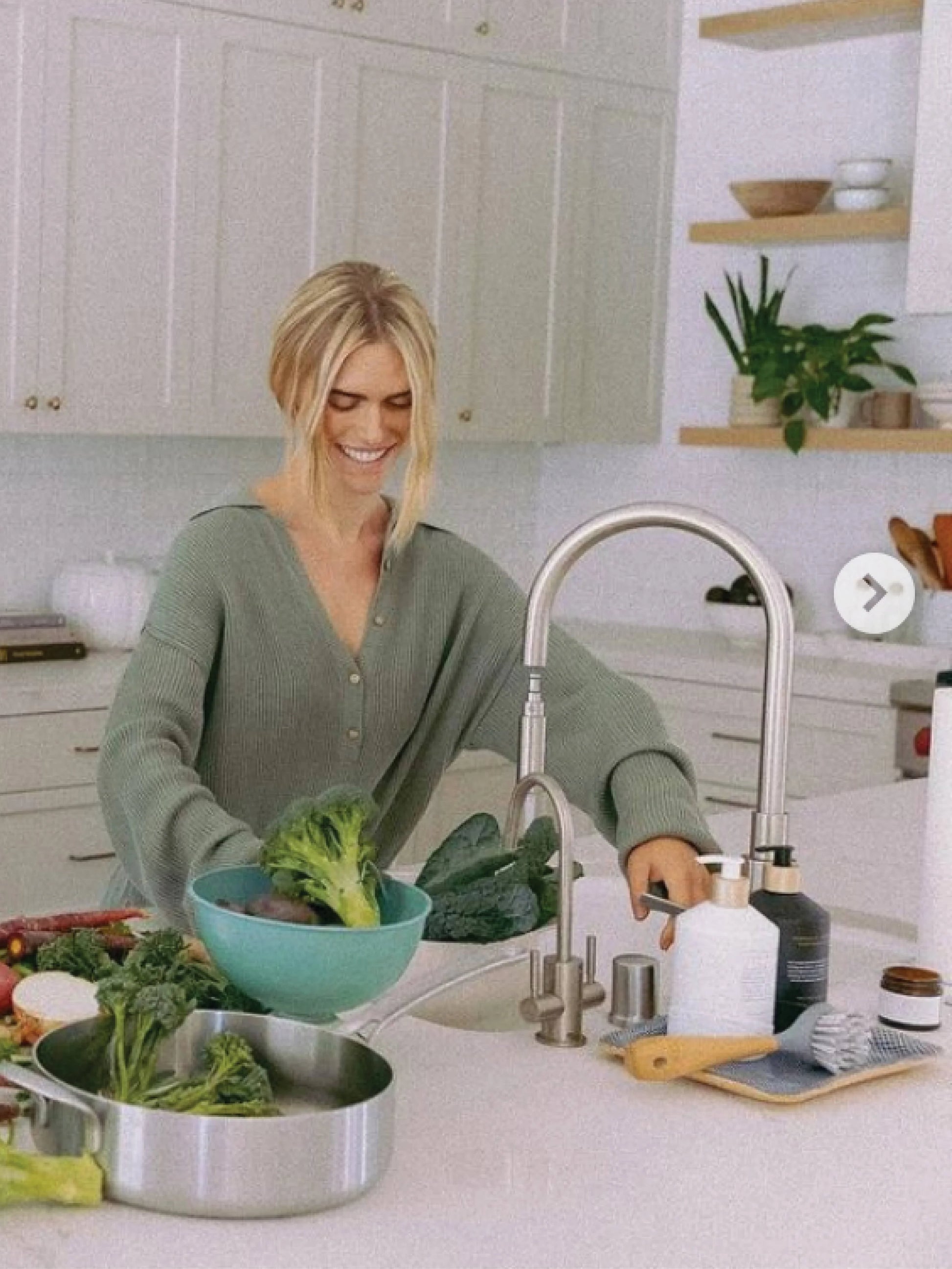 Woman preparing fresh vegetables in a modern kitchen, Come see us at Awaken, Franklin, Tennessee