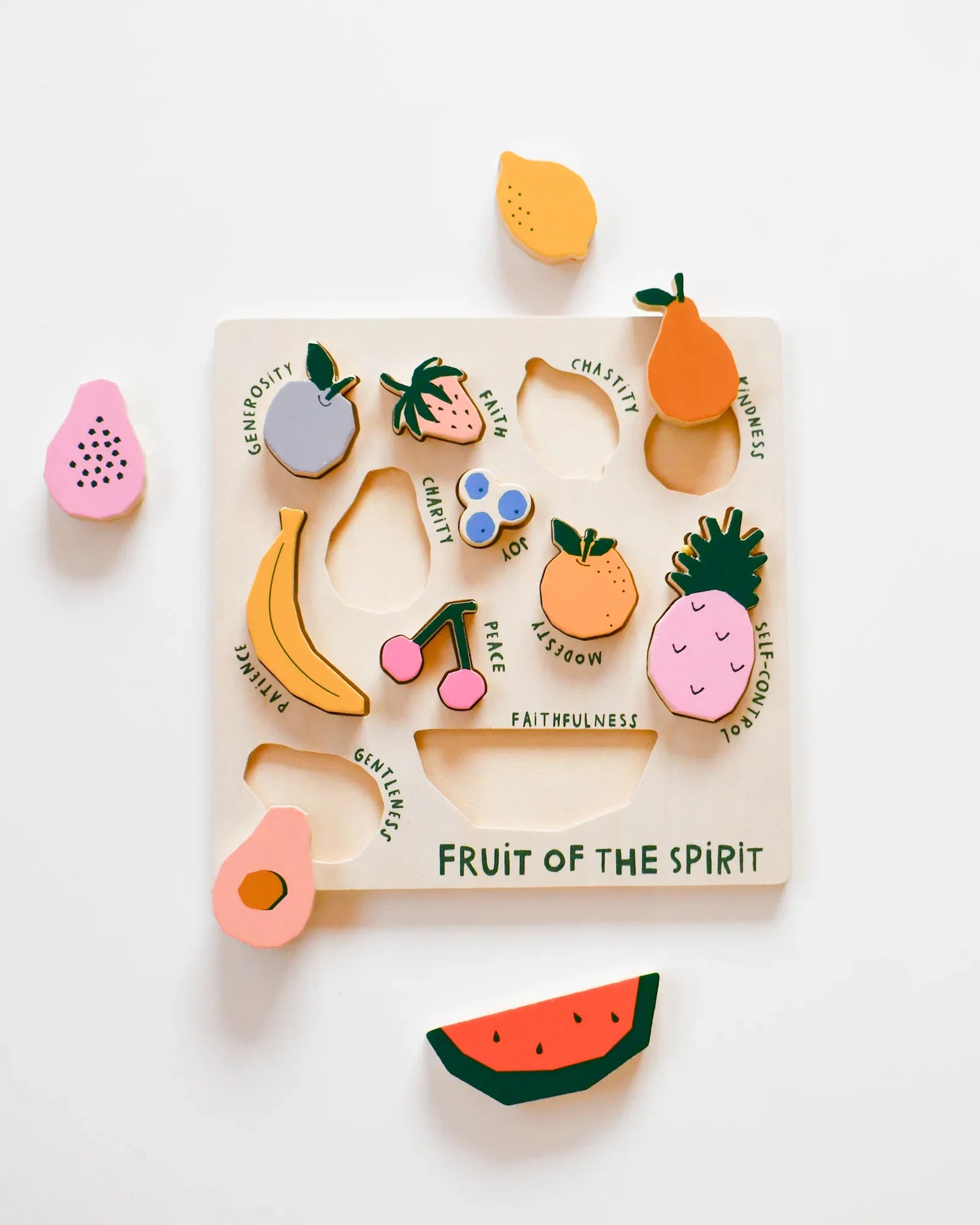 Wooden Fruit of the Spirit puzzle with colorful fruit shapes and virtues labeled, Come see us at Awaken, Franklin, Tennessee