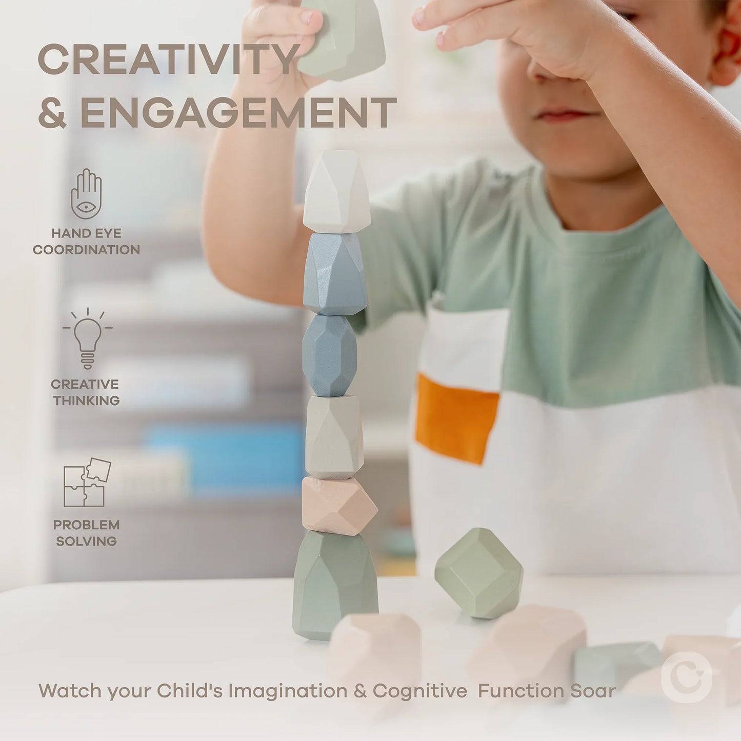 Child stacking pastel geometric blocks highlighting creativity, engagement, problem solving. Come see us at Awaken, Franklin, Tennessee