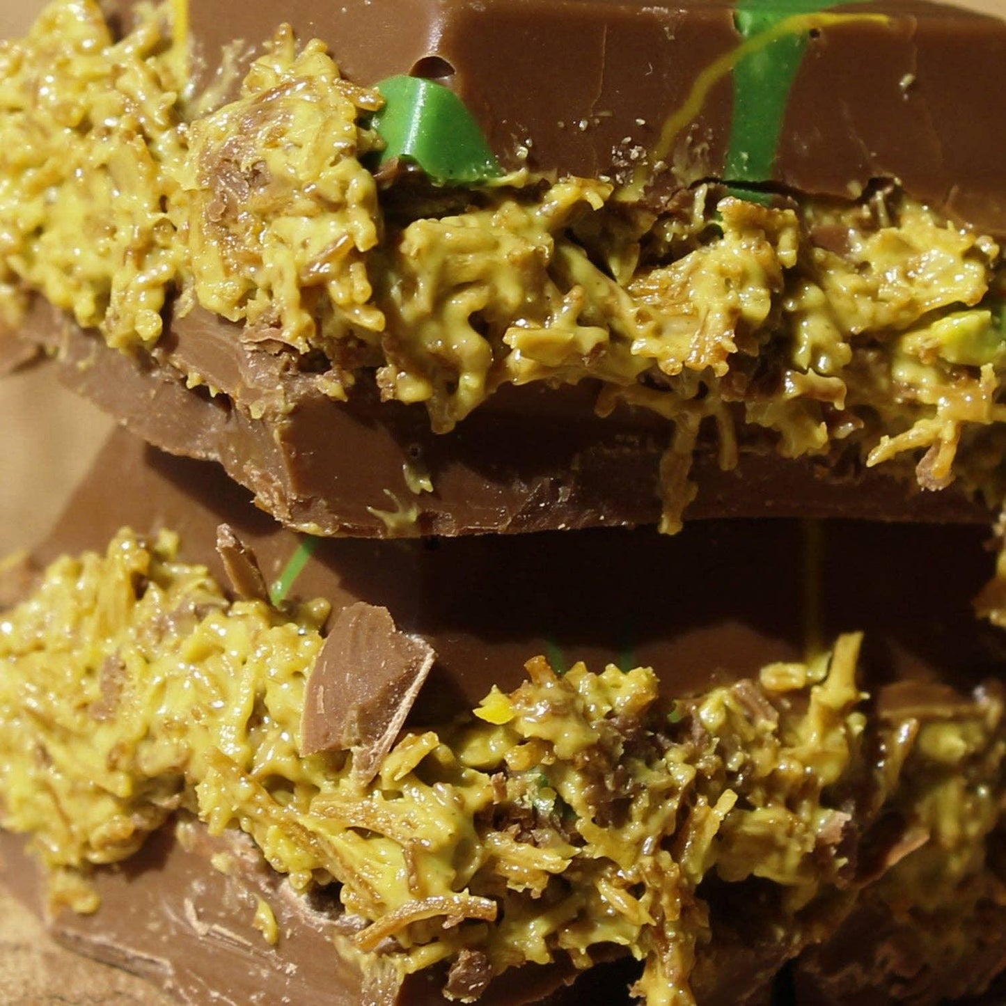 Chocolate candy with crunchy coconut filling, close-up detail. Come see us at Awaken, Franklin, Tennessee.