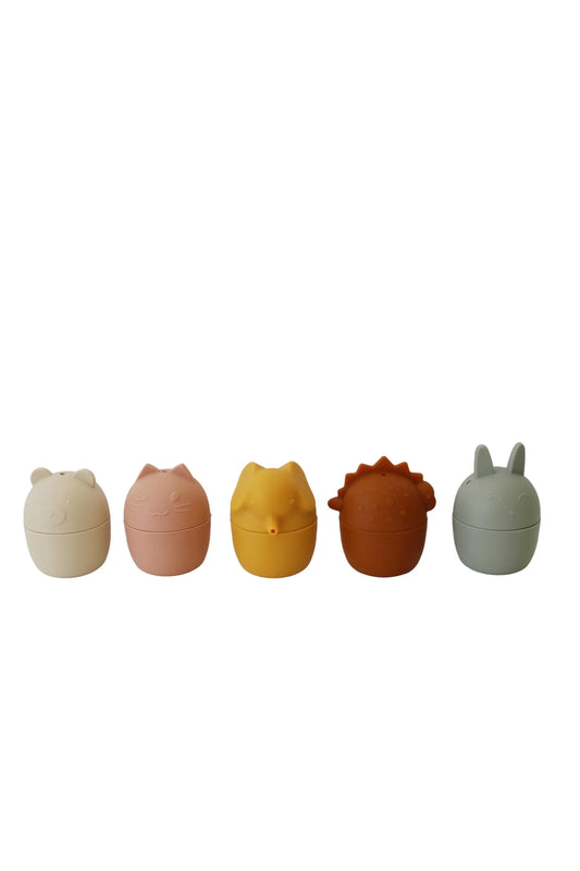 Set of five silicone animal-shaped containers in pastel colors on white background. Come see us at Awaken, Franklin, Tennessee