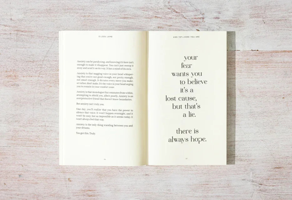 Open book with inspirational text about anxiety and hope on a white wooden table. Come see us at Awaken, Franklin, Tennessee
