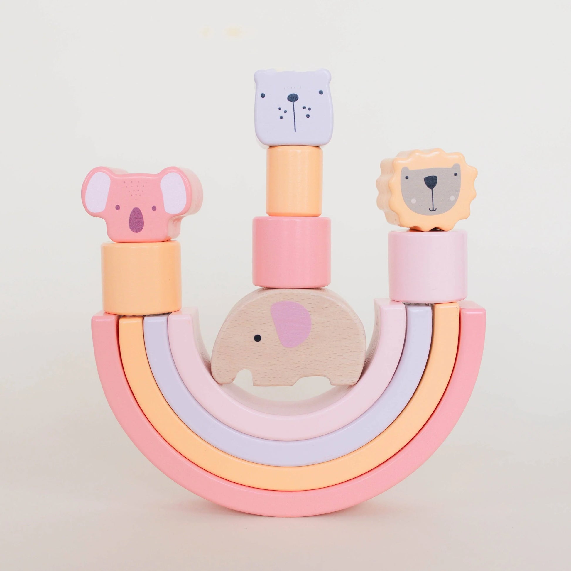 Wooden stacking toy with pastel rainbow and animal figures, Come see us at Awaken, Franklin, Tennessee