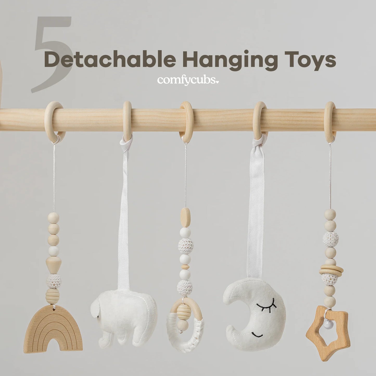 Detachable neutral wooden and plush baby hanging toys with beads on a wooden rod. Come see us at Awaken, Franklin, Tennessee