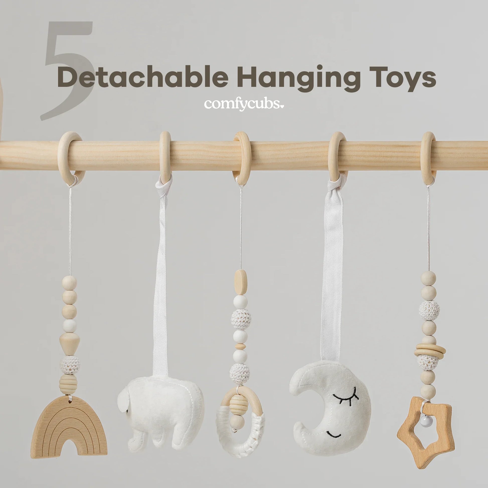 Detachable neutral wooden and plush baby hanging toys with beads on a wooden rod. Come see us at Awaken, Franklin, Tennessee